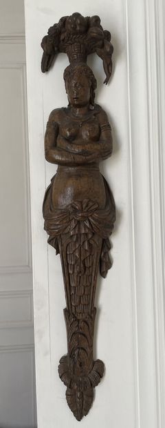 null Piece of woodwork or furniture representing a woman in term supporting a basket...