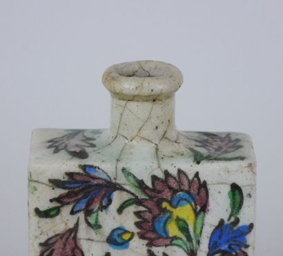 null Two cracked ceramic bottles of rectangular form for the one and rounded for...
