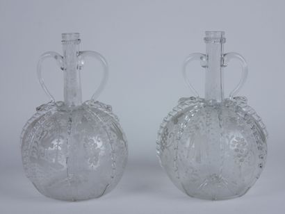 null Two glass decanters in the Venice style, with engraved decoration of birds alternating...