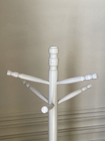 null Set of two coat racks in turned wood and white lacquered resting on a tripod...