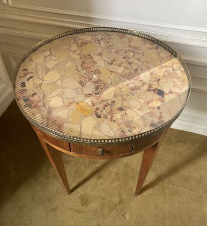 null Circular pedestal table in veneer with geometric marquetry decoration opening...