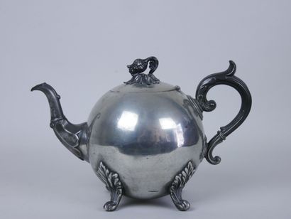 null Set of two silver plated teapots with foliage decoration, the handles resting...