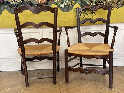 null Pair of armchairs in carved and stained wood, the openwork back, the seat with...
