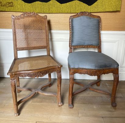 null Set of two caned chairs in molded and carved wood, the cambered legs joined...