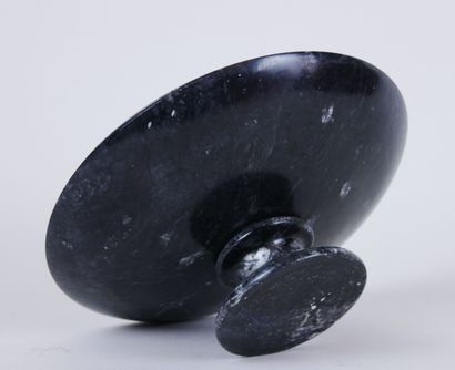 null Large circular bowl on pedestal in black marble with white veins presenting...
