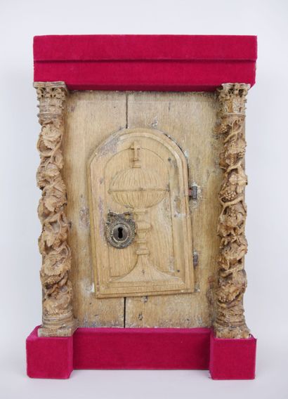 null Front of tabernacle in carved oak opening with an arched door decorated with...
