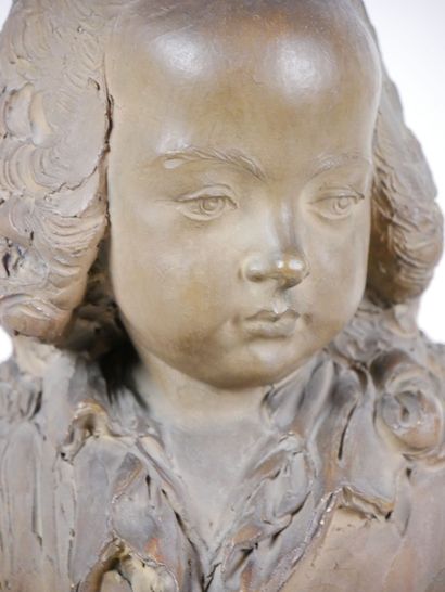 null Sculpture in patinated terra cotta representing the portrait of a child in bust.

In...