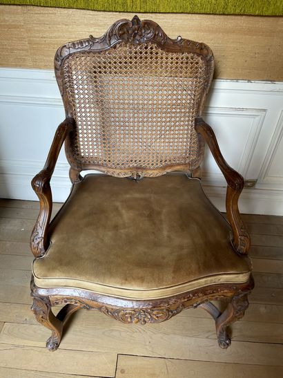 null Caned armchair with flat back and shoulder in molded and carved beech decorated...