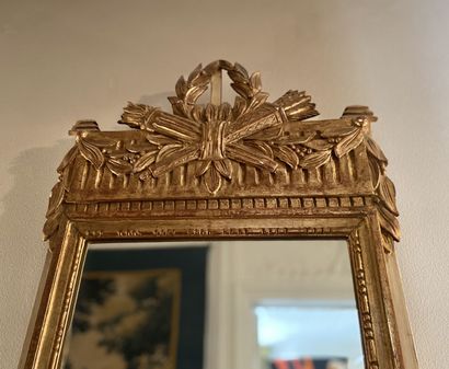 null The frame is made of carved and gilded wood on a cream lacquered background.

Louis...