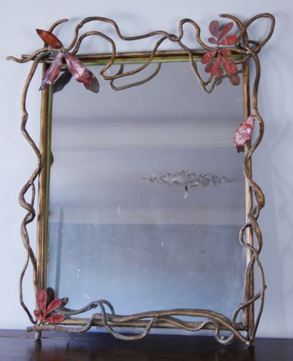 Cast iron mirror with golden patina decorated...