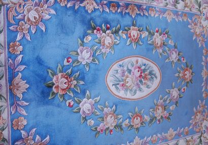 null Wool carpet with a wide border of roses on a beige background, with central...