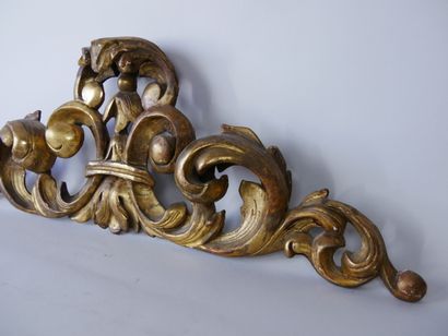 null Carved and gilded wood paneling with foliage decoration. Probably top of a door...