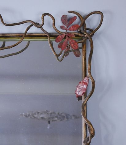 null Cast iron mirror with golden patina decorated with ivy and orange red leaves....
