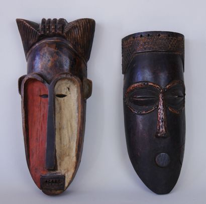 AFRICA

Two African masks in carved and painted...