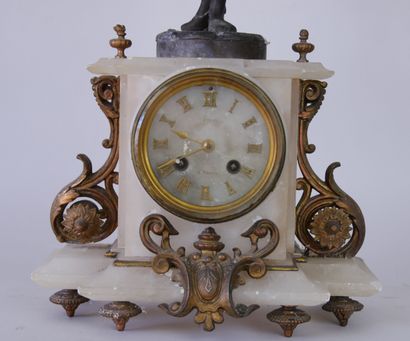 null Mantelpiece clock in white onyx surmounted by a young girl in regula after René...