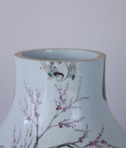  CHINA 
White porcelain baluster vase decorated with maids in a garden accompanied...