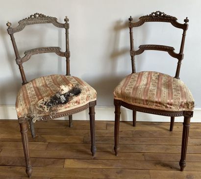 Pair of carved wood chairs with a barred...