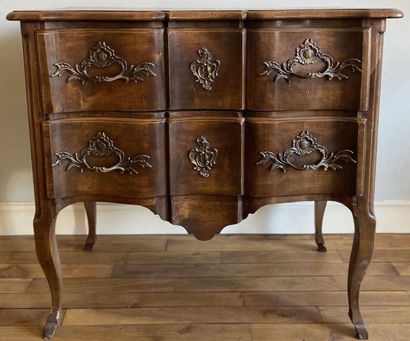 null Walnut chest of drawers opening to two drawers in front of a crossbow, resting...