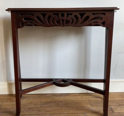 null Console in stained wood and openwork decorated with scrolls resting on a quadripod...