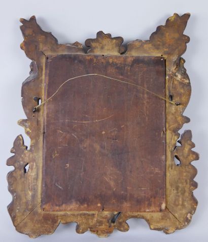 null Carved and gilded wood mirror decorated with scrolls, shells, fire pots, palmettes...