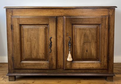 Carved natural wood cabinet opening to two...
