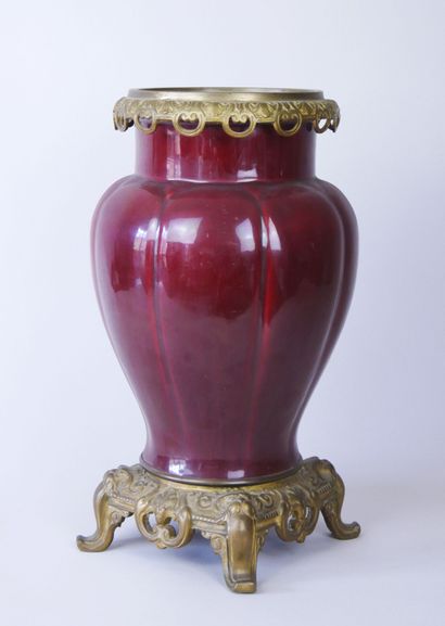 null Vase forming a flowerpot in red enamelled ceramic with decoration of gadroons,...