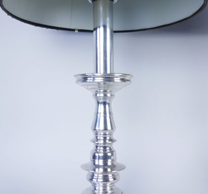 null Pair of silver plated metal torches resting on a circular base. Mounted in lamps....