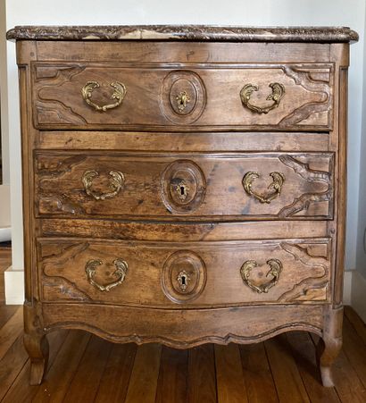 Natural wood chest of drawers opening to...