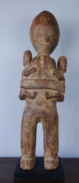 null AFRICA 

Wooden maternity sculpture representing a woman carrying twins on either...