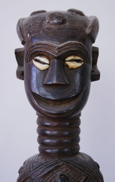 null AFRICA 

Two sculptures in carved and stained wood representing a man standing...