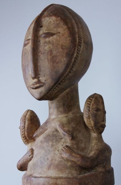 null AFRICA 

Wooden maternity sculpture representing a woman carrying twins on either...