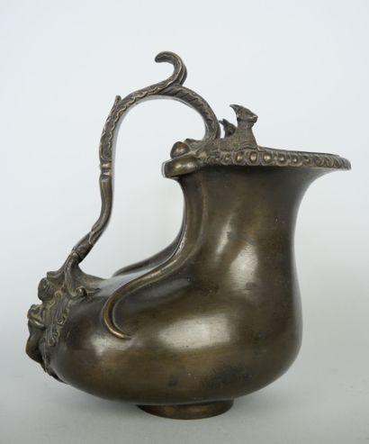 null SIOT Paris 

Bronze pitcher with medal patina decorated with deer. The handle...