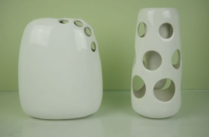 null Lot of white porcelain objects including: 

A vase of baluster form in porcelain...