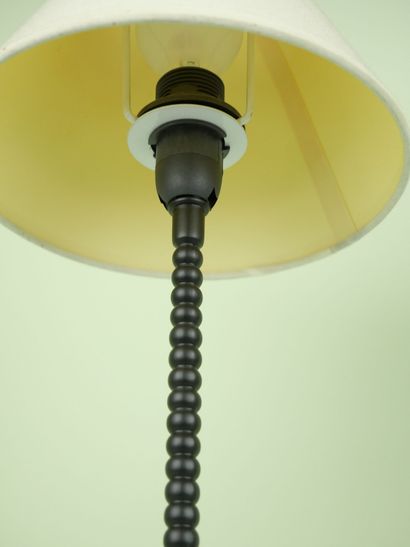 null Pair of black lacquered metal lamps of ball shape resting on a square base....