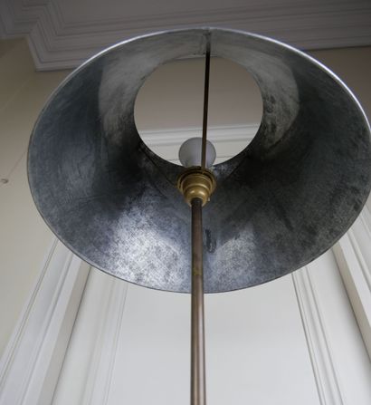 null Modernist floor lamp in zinc resting on a square base, the lampshade of circular...