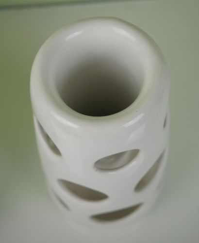 null Lot of white porcelain objects including: 

A vase of baluster form in porcelain...