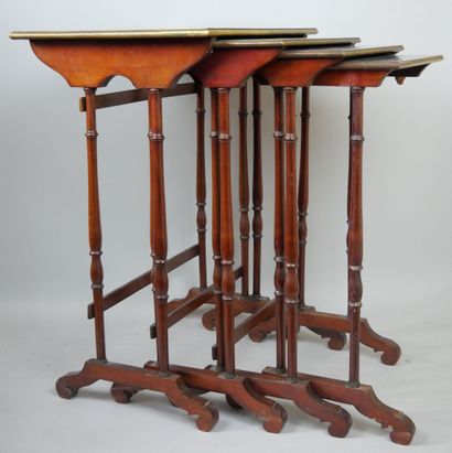 null Suite of four mahogany veneered and brass filleted nesting tables.

End of the...