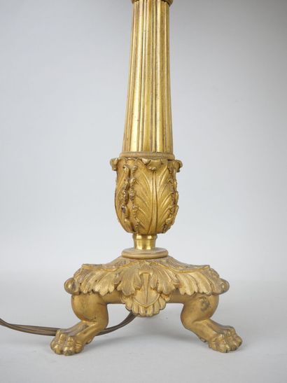 null A pair of ormolu torches resting on a tripod base.

Louis-Philippe period.

(Mounted...