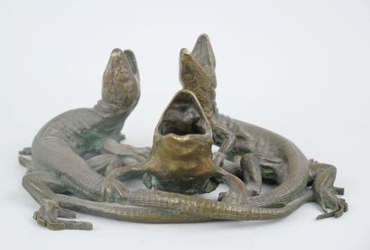 null Group in bronze with a brown-green patina representing a frog accompanied by...