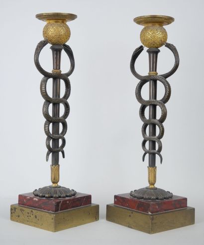 null Pair of rare bronze torches with brown patina, gilt bronze and cherry red marble,...