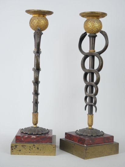 null Pair of rare bronze torches with brown patina, gilt bronze and cherry red marble,...