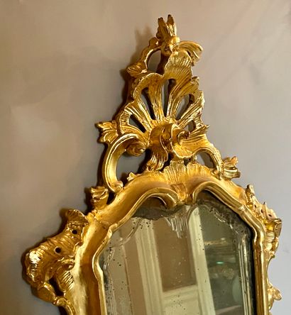 null Rectangular glass, the rocaille frame in carved and gilded wood.

Italy, 19th...