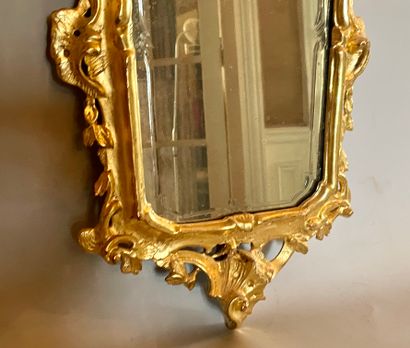null Rectangular glass, the rocaille frame in carved and gilded wood.

Italy, 19th...