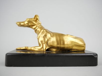 null Paperweight in gilt bronze representing a greyhound lying down. Black marble...