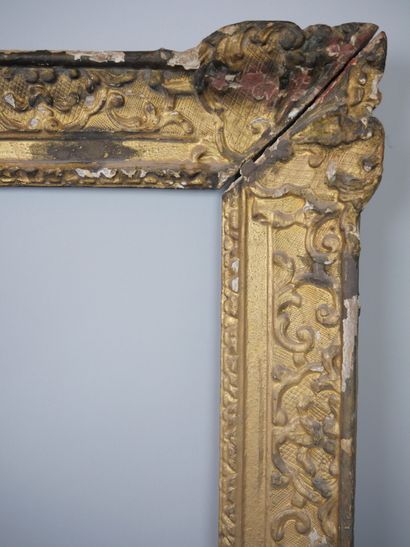 null Rectangular frame in wood, formerly gilded and repatinated, decorated with cartouches...