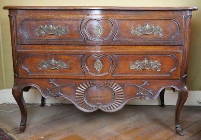 null Moulded and carved walnut chest of drawers, opening with two drawers on two...
