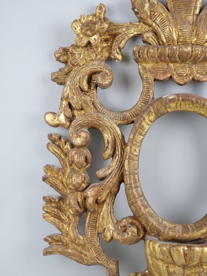 null A carved and gilded wood stoup with an openwork decoration of scrolling foliage.

Eighteenth...