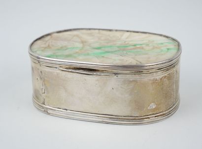 Oval silver box, the lid set with a jadeite...