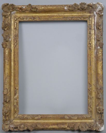 null Small carved and gilded wood frame with openwork decoration of shells and flowers....