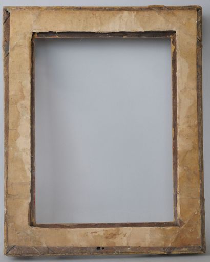 null Rectangular frame in carved and gilded wood, the corners decorated with shells...